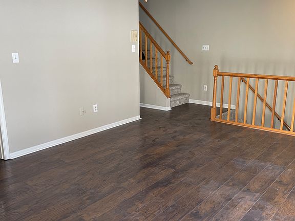 Updated living room with fireplace. Private balcony through French doors.