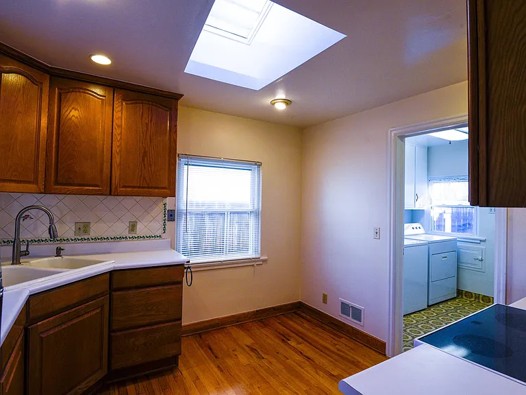 View as you walk into kitchen. Space for a small kitchen table that could seat 4.