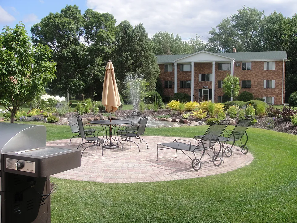 Beautiful, serene patio sitting area by landscaped fountain