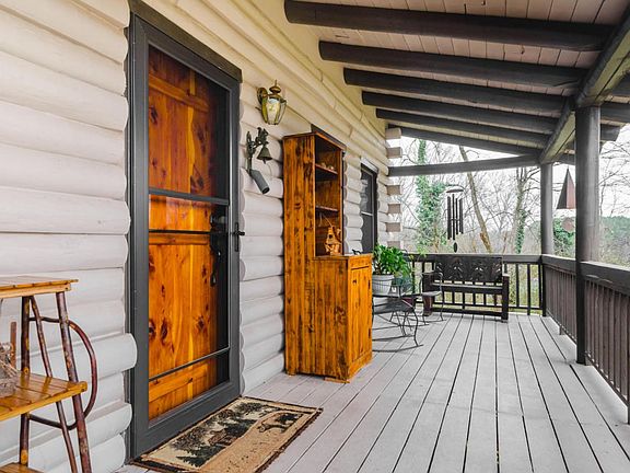 Painted logs and porch - fresh!