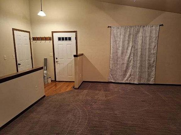 living room/front door to basement & garage door