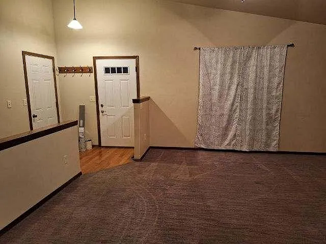 living room/front door to basement & garage door