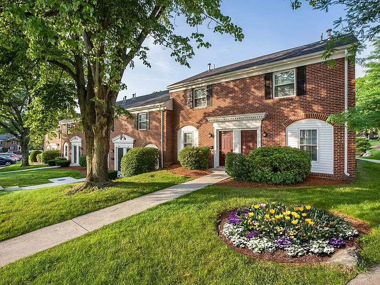 Two floor townhome living with private entry ways and plenty of New England charm
