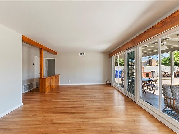Lovely Bamboo Hardwood Flooring througouth the home, wall of glass views into the back yard.