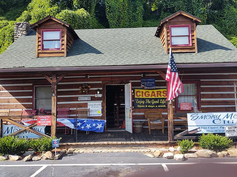 Front building with full covered porch and dedicated 5 parking spotd