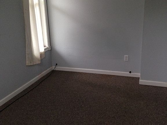 Carpeted bedroom.