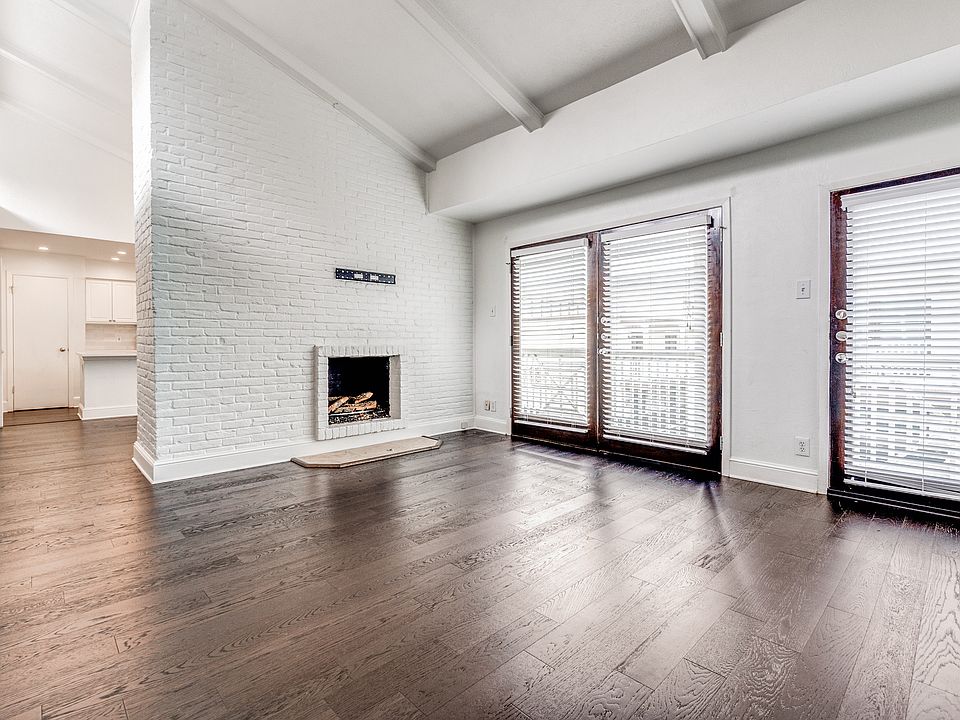 This is the view of the living area where the TV can be right above the fireplace and the vaulted ceilings really makes this a desirable place to live.