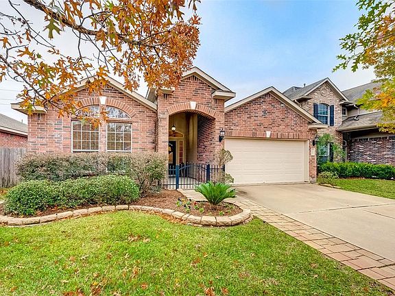 Beautiful elevation and landscaping give this home fantastic curb appeal. Sprinkler system was recently added to this property