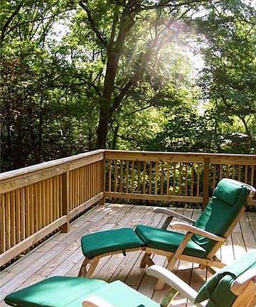 New 12x20 deck overlooks your wooded retreat on nearly one acre.