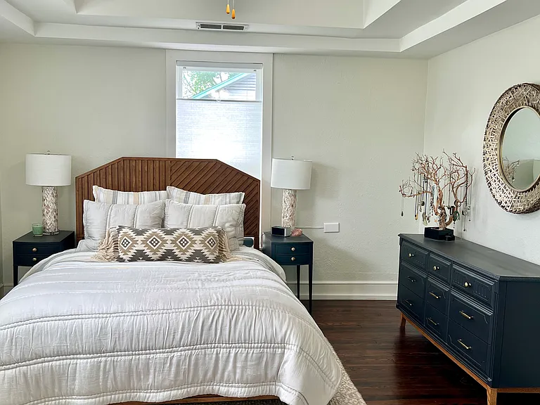 Spacious master bedroom with incredible natural light and tree canopy views