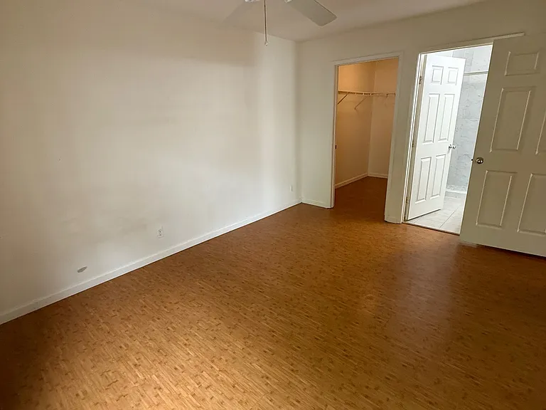 Master bedroom - view of walk in closet and entry into en suite bathroom