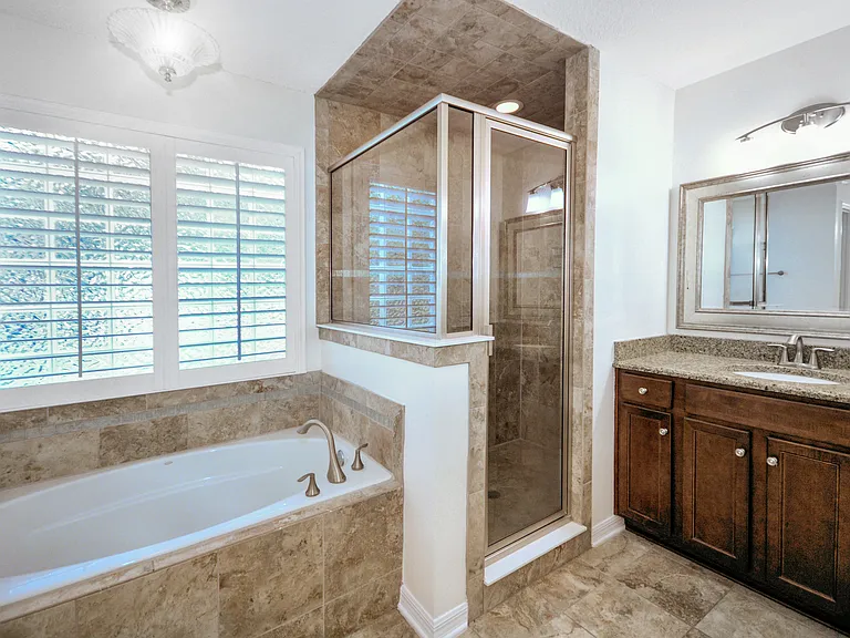 Primary suite bathroom showing one of two vanities
