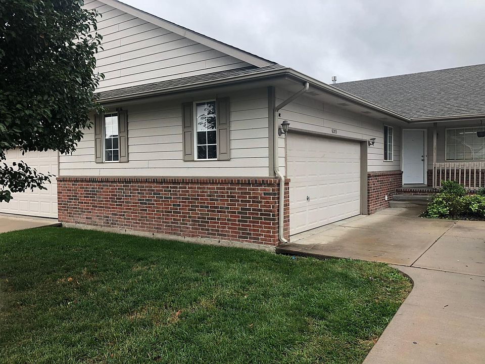 Side load 2-car garage and front porch.