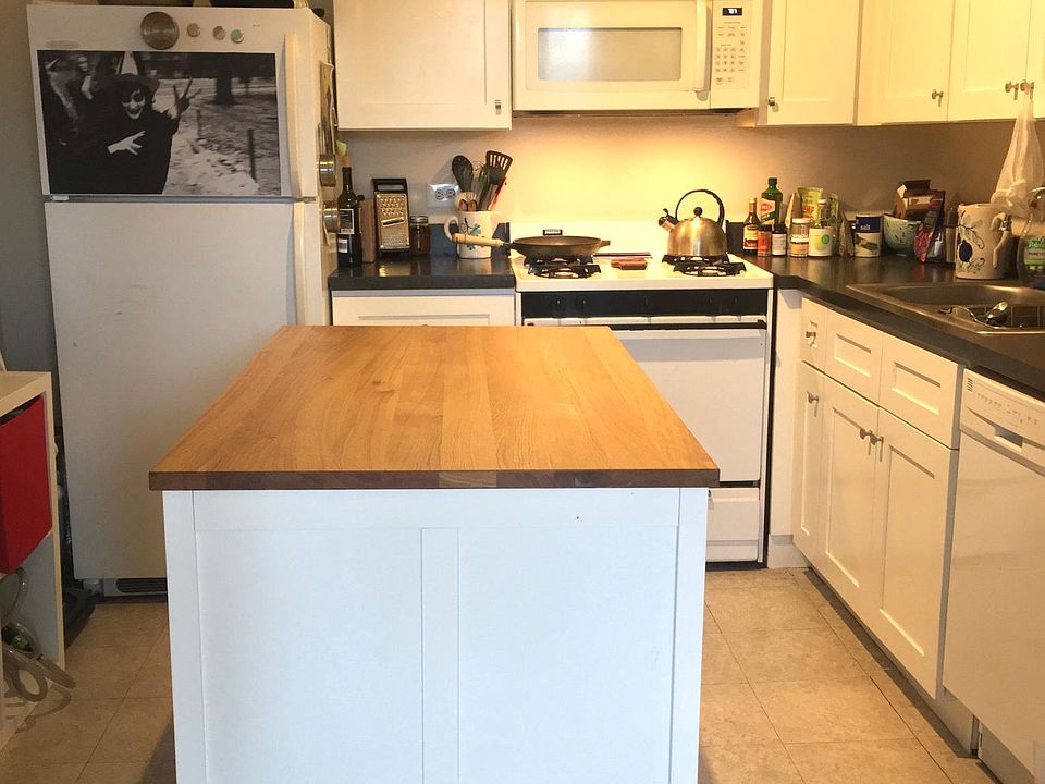 Kitchen with hood microwave and DW (center island cabinet belongs to current occupants)