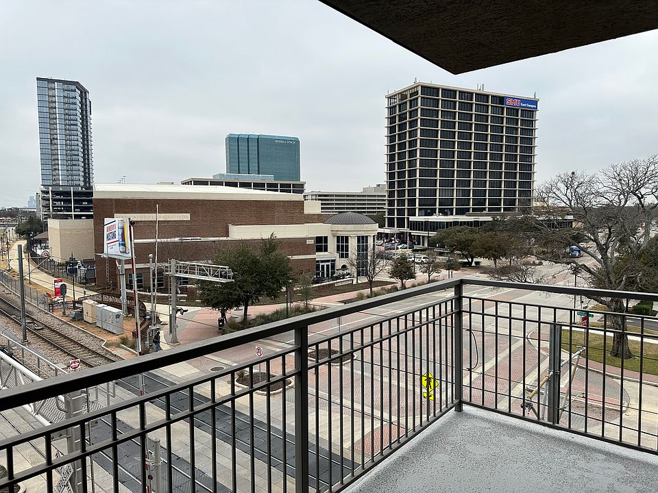 Balcony from living room featuring a city view