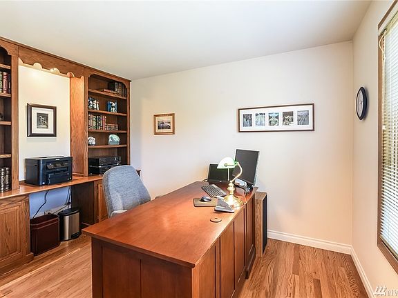 The luxurious Master Suite!  An adult retreat with hardwood floors, vaulted ceiling and pleasant views.  