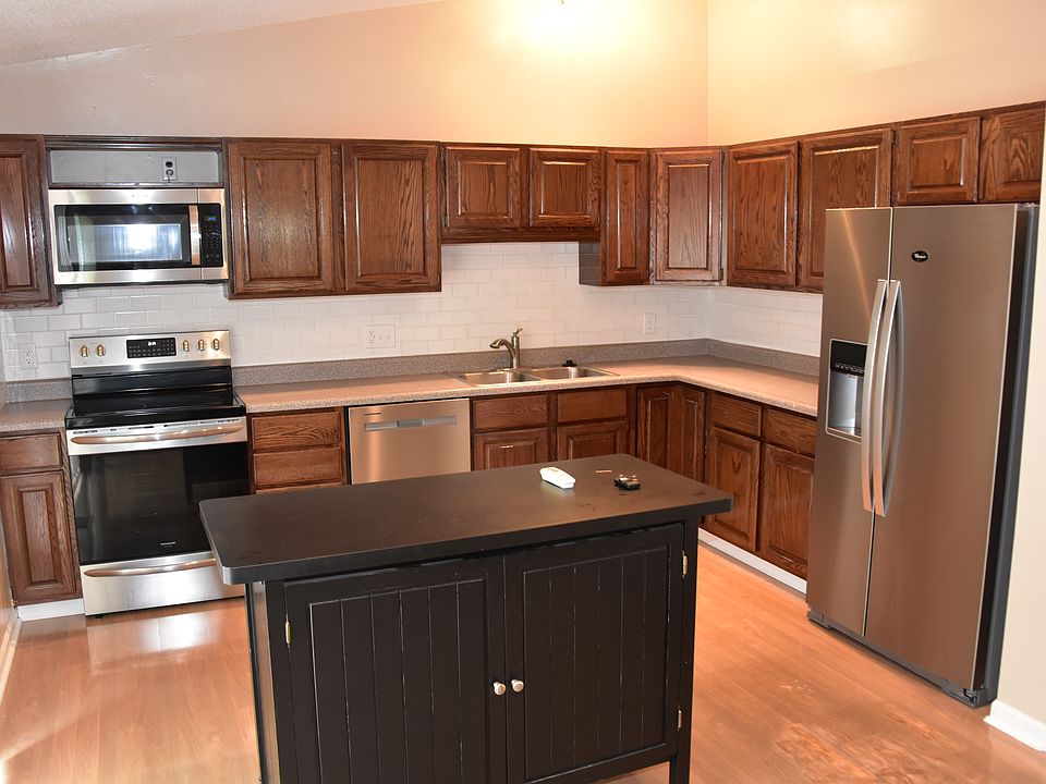 Kitchen with new appliances; range/oven, microwave, dishwasher and refrigerator