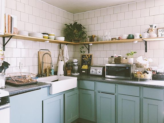 Kitchen with concealed dishwasher next to sink.