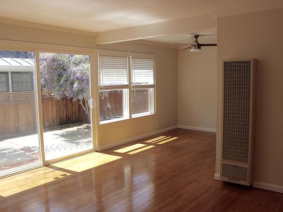 family room and kitchen nook with new windows and sliding door