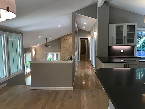 View from dining room towards hallway to upstairs bedrooms and bathroom