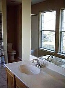 Master bath with garden tub and walk-in closet