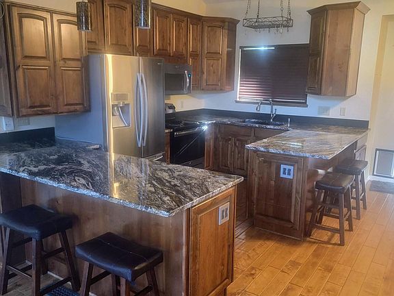 Main Level: 
This remodeled kitchen, features granite countertops, plenty of cabinet space, and an open layout that connects easily with the rest of the main level.