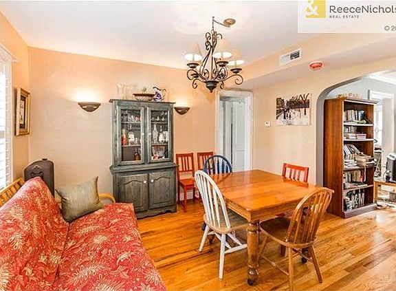 The large dining room connects the living room to the kitchen and hallway to the full bath.