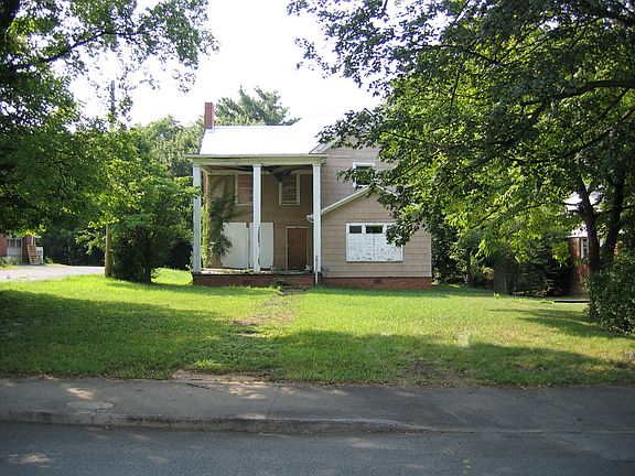 Sidewalk with driveway cut.  Level land.
One block from Main St, Lexington.