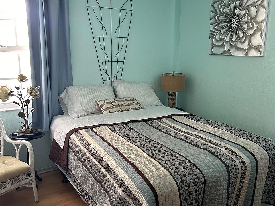 In the bedroom: Queen size really comfy bed. Sun blocking curtains, (cute lamps (maybe shown later?)