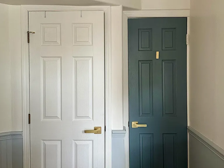 Bathroom on the left and exit to back patio and laundry room.