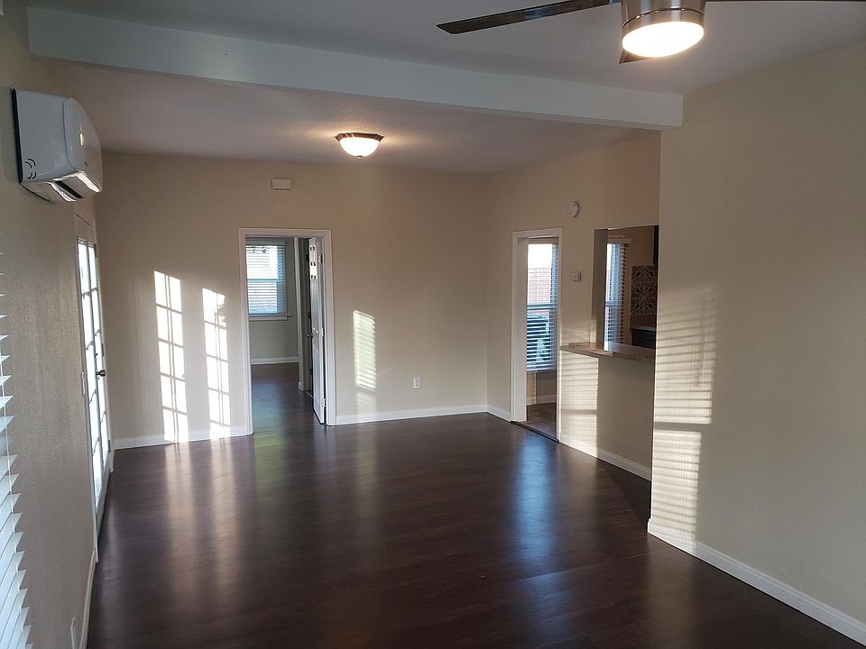 Spacious front room area with double french doors leading to private patio access.