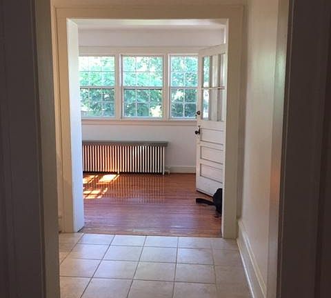 Back dining/sitting area off kitchen, overlooking large back yard.