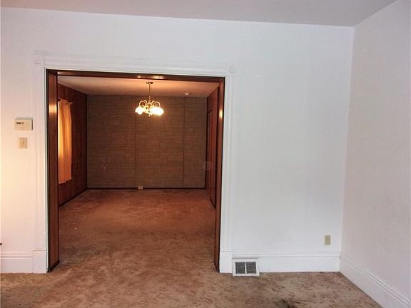Living room view into dining room.