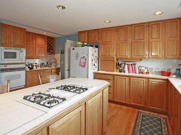 A large island kitchen with eating space.