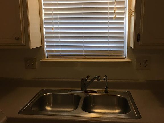 Kitchen sink with window view to the backyard