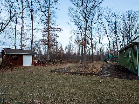 Side yard w/ shed & gardens