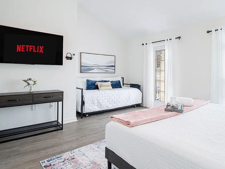 Relax in this comfortable double twin day-bed that evokes a sense of serenity and mimic the coastal landscape. Room includes 55' Roku Smart TV.
