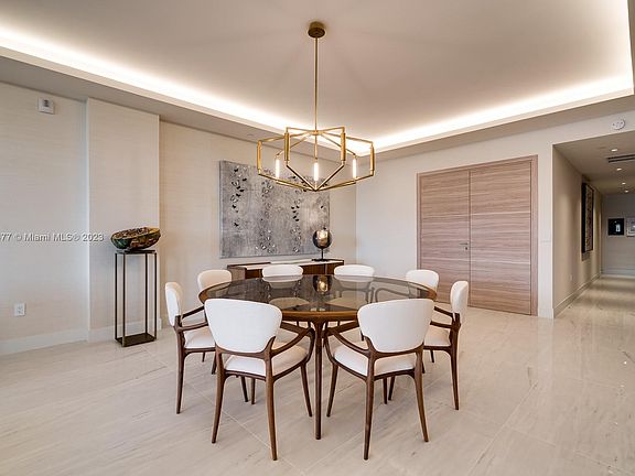 In this picture you are looking East from the diningroom and notice that the 2 front Wood Grained Doors are closed from your private elevator and Foyer and the hallway to the right leads you to the other 2Bdrms with their own in-suite baths plus the half