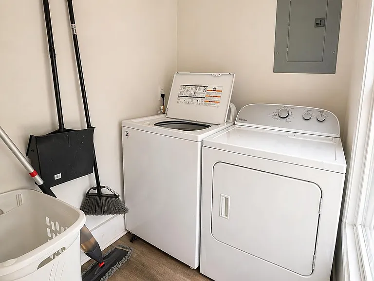 Dedicated laundry nook with full-size washer and dryer