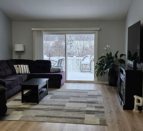 Newly remodeled dining/living area with cathedral ceiling.