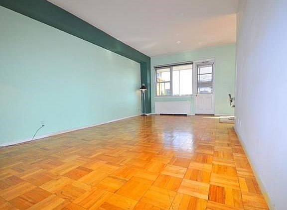 The bright and airy "L" shaped living room and dining room has Southern exposures and parquet floors.  The living room also opens to the entry foyer. There is a door leading to a private balcony.  The living room is 20'-0" x 12'-0" and the entry foyer is 