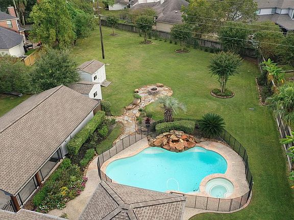 Refreshing pool/spa and rock waterfall and a beautiful stone path to the fire pit.