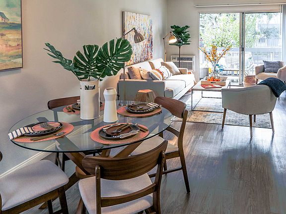 Wood-inspired flooring throughout dining and living room
