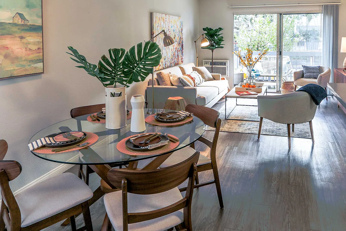 Wood-inspired flooring throughout dining and living room - Violet on Virgil