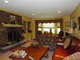 Spacious Family Room: Woodburning Fireplace