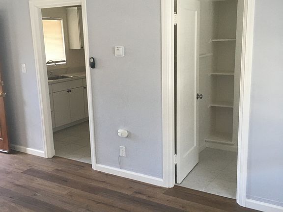 Kitchen and bathroom doors in main room.