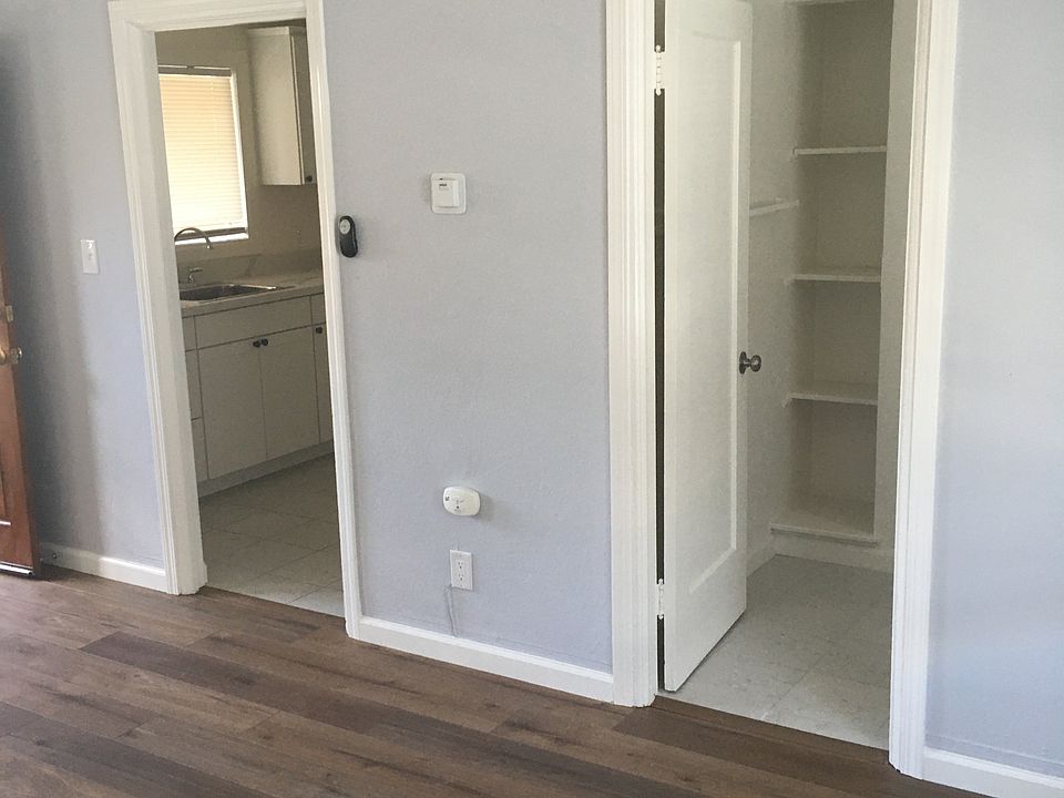 Kitchen and bathroom doors in main room.