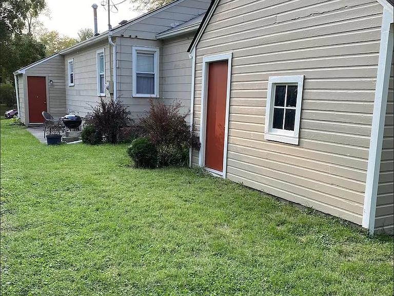 Backyard with privacy fence and patio.
