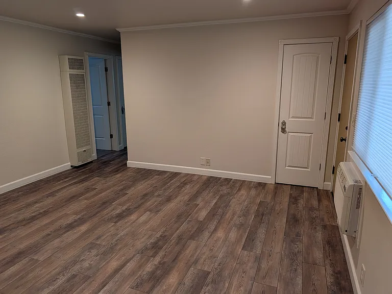 Living room with high-end LVP flooring throughout the entire apartment