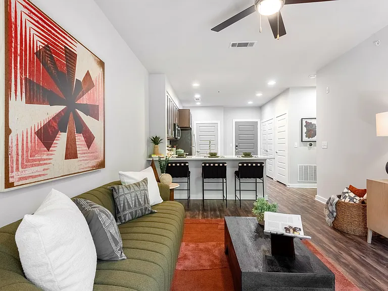 Modern Living Area with Colorful Touches and Seamless Kitchen Access